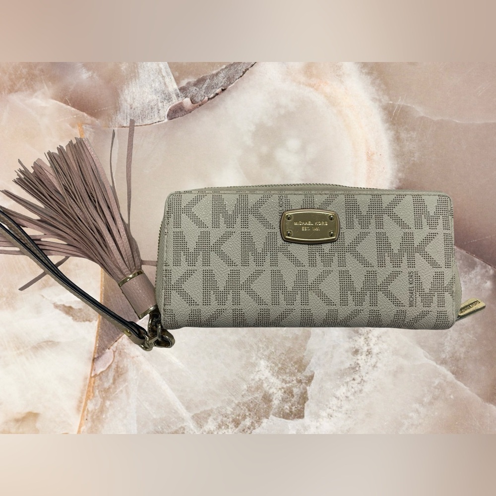 Michael Kors, leather wristlet wallet with tassel condition used